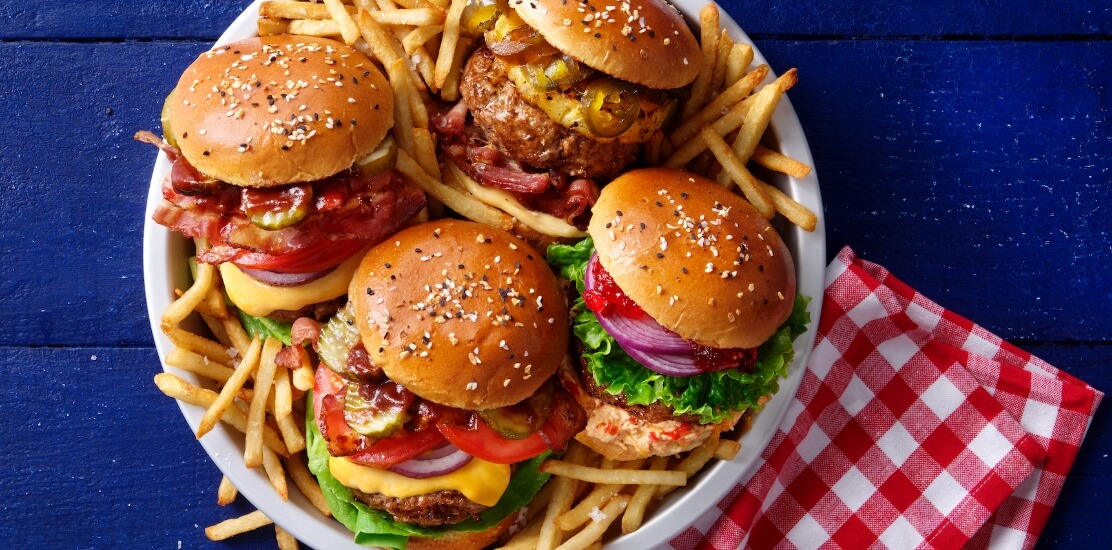 4 yummy burgers on a plate