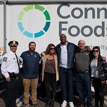 H&P and Southern Connecticut State University Basketball team volunteer at CT FoodShare’s Stuff-A-Bus Food Drive